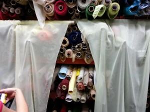 Checking sheerness and color of the silk.